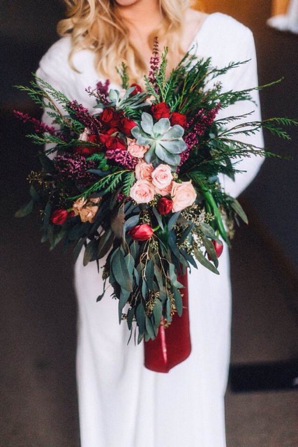 burgundy, pink, green, and red floral bridal bouquet